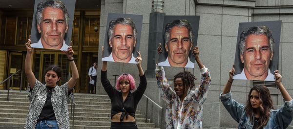 A protest group called Hot Mess hold up signs of Jeffrey Epstein in front of the Federal courthouse on July 8, 2019 in New York City A protest group called Hot Mess hold up signs of Jeffrey Epstein in front of the Federal courthouse on July 8, 2019 in New York City - Sputnik International