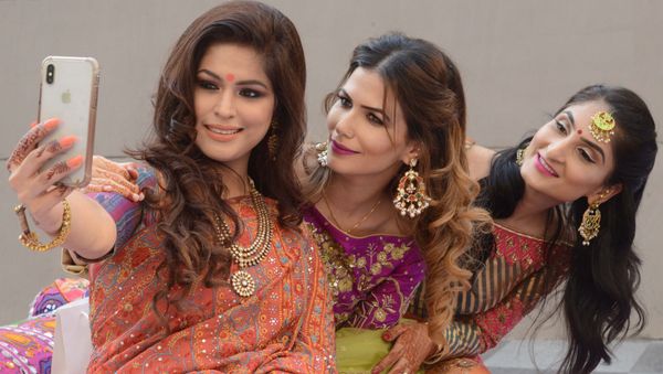 India women take a photograph with their mobile phone during celebrations of the Karva Chauth (Husband's Day) festival in Amritsar on October 27, 2018 - Sputnik International