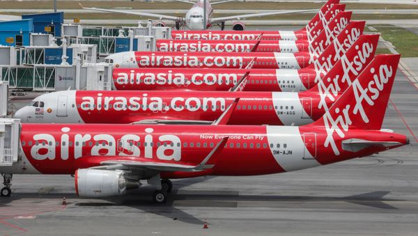 FILE PHOTO: AirAsia planes are seen parked at Kuala Lumpur International Airport 2, during the movement control order due to the outbreak of the coronavirus disease (COVID-19), in Sepang, Malaysia April 14, 2020 - Sputnik International