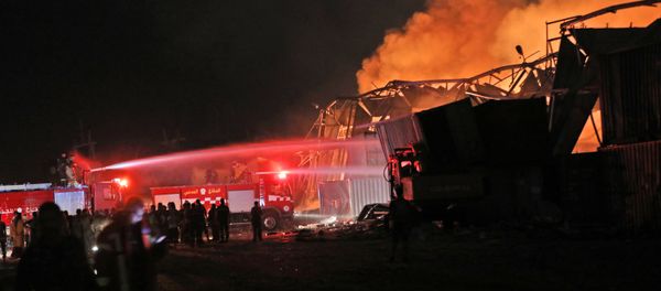 Firefighters douse a blaze at the scene of an explosion at the port of Lebanon's capital Beirut on August 4, 2020 Firefighters douse a blaze at the scene of an explosion at the port of Lebanon's capital Beirut on August 4, 2020 - Sputnik International