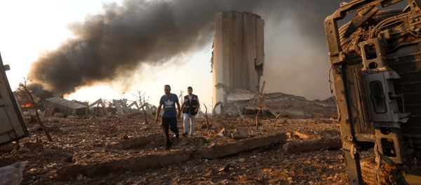 Men walk at the site of an explosion in Beirut, Lebanon August 4, 2020 Men walk at the site of an explosion in Beirut, Lebanon August 4, 2020 - Sputnik International