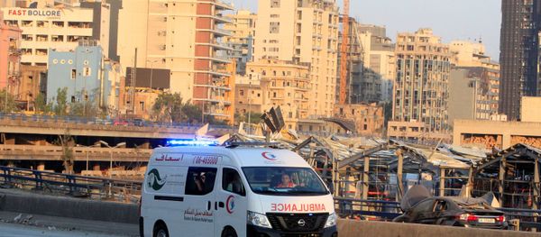 An ambulance drives near the site of Tuesday's blast in Beirut's port area, Lebanon August 5, 2020. REUTERS/Aziz Taher - Sputnik International