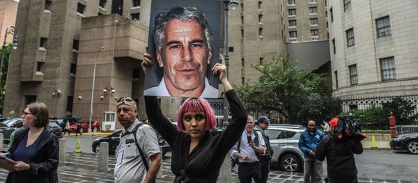 NEW YORK, NY - JULY 08: A member of a protest group called Hot Mess holds up a sign of Jeffrey Epstein in front of the Metropolitan Correction Center on July 8, 2019 in New York City - Sputnik International