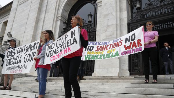 Protesters from the organization Code Pink, protest what they refer to as a coup in Venezuela, on the steps of the Organization of American States (OAS), Tuesday April 9, 2019 Protesters from the organization Code Pink, protest what they refer to as a coup in Venezuela, on the steps of the Organization of American States (OAS), Tuesday April 9, 2019 - Sputnik International