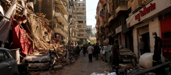People walk past damaged buildings and vehicles following Tuesday's blast in Beirut's port area, Lebanon 5 August 2020. People walk past damaged buildings and vehicles following Tuesday's blast in Beirut's port area, Lebanon 5 August 2020. - Sputnik International