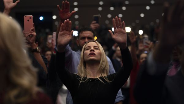 Supporters pray as US President Donald Trump speaks during a 'Evangelicals for Trump' campaign event held at the King Jesus International Ministry on January 03, 2020 in Miami, Florida - Sputnik International