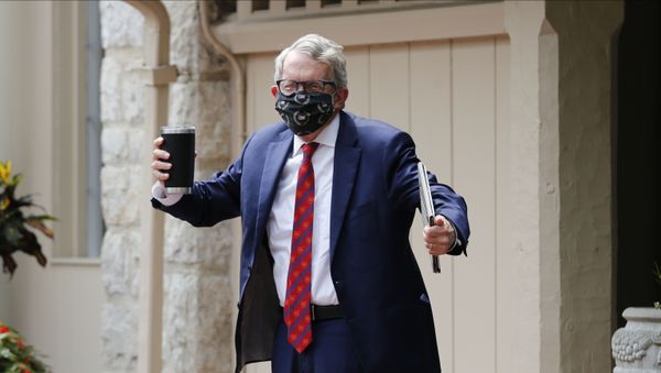 Ohio Governor Mike DeWine shrugs his shoulders in response to a reporter's question about him testing positive for COVID-19 Thursday, Aug. 6, 2020, in Bexley, Ohio - Sputnik International