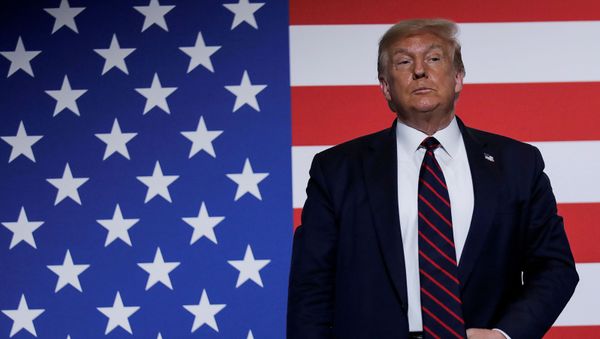  U.S. President Donald Trump stands in front of a U.S. flag as he participates in a roundtable on donating plasma during a visit to the American Red Cross National Headquarters in Washington, U.S., July 30, 2020 - Sputnik International