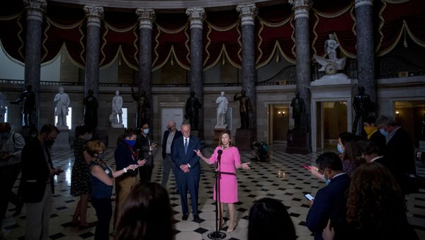 House Speaker Nancy Pelosi of Calif., center, accompanied by Senate Minority Leader Sen. Chuck Schumer of N.Y., left, speaks to members of the media after meeting with Treasury Secretary Steven Mnuchin and White House Chief of Staff Mark Meadows as they continue to negotiate a coronavirus relief package on Capitol Hill in Washington, Friday, Aug. 7, 2020. House Speaker Nancy Pelosi of Calif., center, accompanied by Senate Minority Leader Sen. Chuck Schumer of N.Y., left, speaks to members of the media after meeting with Treasury Secretary Steven Mnuchin and White House Chief of Staff Mark Meadows as they continue to negotiate a coronavirus relief package on Capitol Hill in Washington, Friday, Aug. 7, 2020. - Sputnik International