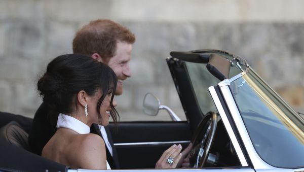 The newly married Duke and Duchess of Sussex, Meghan Markle and Prince Harry, leave Windsor Castle after their wedding to attend an evening reception at Frogmore House, hosted by the Prince of Wales. - Sputnik International