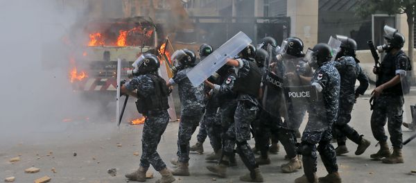 Lebanese security forces advance during clashes with protesters in downtown Beirut on August 8, 2020, following a demonstration against a political leadership they blame for a monster explosion that killed more than 150 people and disfigured the capital Beirut. Lebanese security forces advance during clashes with protesters in downtown Beirut on August 8, 2020, following a demonstration against a political leadership they blame for a monster explosion that killed more than 150 people and disfigured the capital Beirut. - Sputnik International
