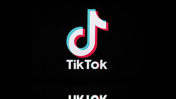 This file photo taken on November 21, 2019, shows the logo of the social media video sharing app Tiktok displayed on a tablet screen in Paris. - Sputnik International