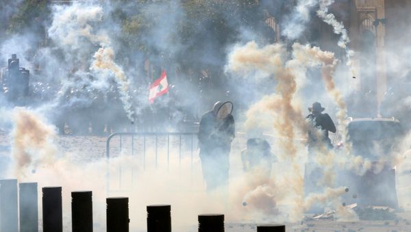 Riot police fire tear gas at demonstrators during a protest, following Tuesday's blast, in Beirut, Lebanon, 8 August 2020. Riot police fire tear gas at demonstrators during a protest, following Tuesday's blast, in Beirut, Lebanon, 8 August 2020. - Sputnik International