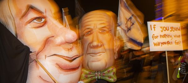 Demonstrators wear masks depicting Israel's Prime Minister Benjamin Netanyahu, left, and Defense Minister and coalition partner Benny Gantz, right, during a protest against Israel's Prime Minister outside his residence in Jerusalem, Israel, Saturday, 8 August 2020.  - Sputnik International