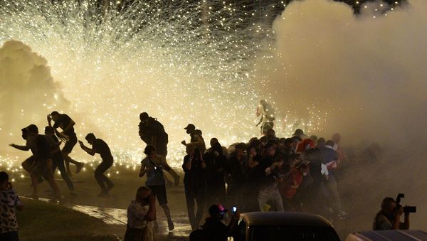 Opposition protesters are dispersed by riot police during clashes after polls closed in Belarus' presidential election, in Minsk, Belarus - Sputnik International