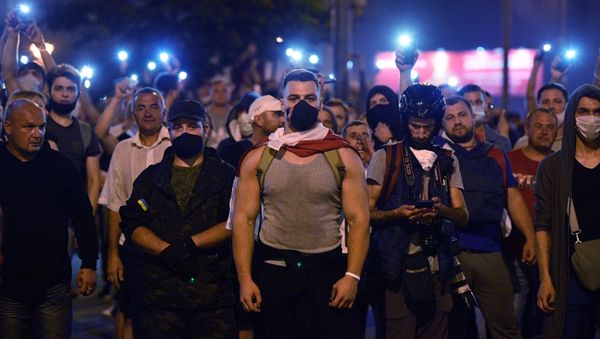 Protesters took to the streets of Minsk on Sunday night after official exit polls projected a landslide victory for the incumbent President Lukashenko Protesters took to the streets of Minsk on Sunday night after official exit polls projected a landslide victory for the incumbent President Lukashenko - Sputnik International