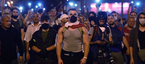Protesters took to the streets of Minsk on Sunday night after official exit polls projected a landslide victory for the incumbent President Lukashenko Protesters took to the streets of Minsk on Sunday night after official exit polls projected a landslide victory for the incumbent President Lukashenko - Sputnik International