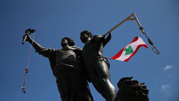 Nooses and a Lebanese flag are placed on a statue on Martyrs' monument, before a protest following the blast in Beirut, Lebanon, August 10, 2020 Nooses and a Lebanese flag are placed on a statue on Martyrs' monument, before a protest following the blast in Beirut, Lebanon, August 10, 2020 - Sputnik International