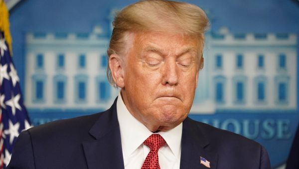 U.S. President Donald Trump holds during a coronavirus disease (COVID-19) pandemic briefing at the White House in Washington, U.S., August 10, 2020.  - Sputnik International