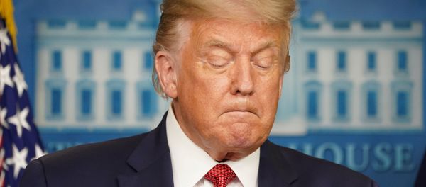 U.S. President Donald Trump holds during a coronavirus disease (COVID-19) pandemic briefing at the White House in Washington, U.S., August 10, 2020.  - Sputnik International