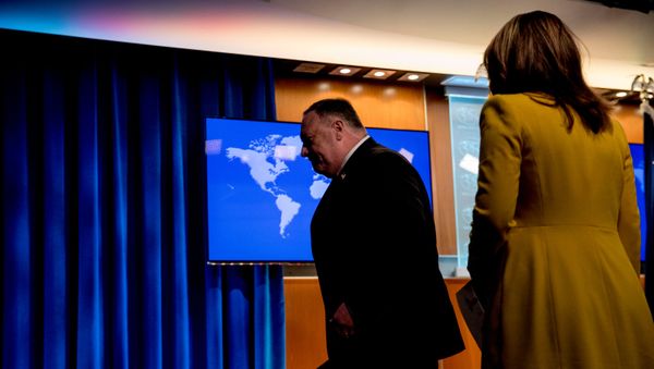 U.S. Secretary of State Mike Pompeo, accompanied by State Department spokeswoman Morgan Ortagus, leaves a news conference at the State Department in Washington, D.C., U.S.,  July 15, 2020. - Sputnik International