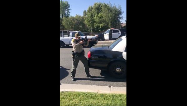 Cellphone recording captures deputies with California's Los Angeles County Sheriff's Department holding teens at gunpoint moments after they were attacked by a knife-wielding individual at a bus stop. An investigation has been launched into the August 7, 2020, encounter. - Sputnik International