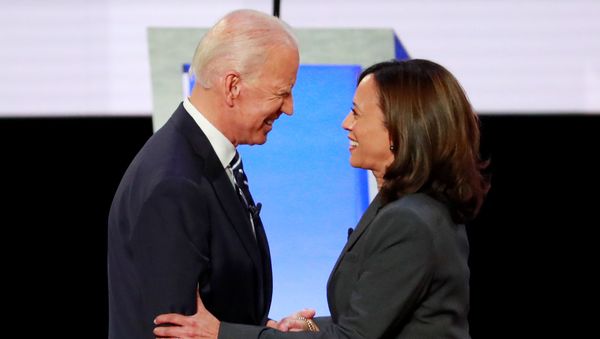Former Vice President Joe Biden and U.S. Senator Kamala Harris shake hands before the start of the second night of the second U.S. 2020 presidential Democratic candidates debate in Detroit, Michigan, U.S., July 31, 2019. Former Vice President Joe Biden and U.S. Senator Kamala Harris shake hands before the start of the second night of the second U.S. 2020 presidential Democratic candidates debate in Detroit, Michigan, U.S., July 31, 2019. - Sputnik International