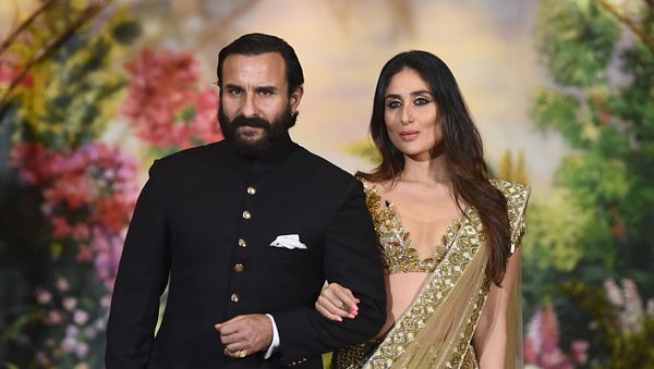 Indian Bollywood actors Saif Ali Khan and wife Kareena Kapoor Khan pose for a picture during the wedding reception of actress Sonam Kapoor and businessman Anand Ahuja in Mumbai late on May 8, 2018 Indian Bollywood actors Saif Ali Khan and wife Kareena Kapoor Khan pose for a picture during the wedding reception of actress Sonam Kapoor and businessman Anand Ahuja in Mumbai late on May 8, 2018 - Sputnik International