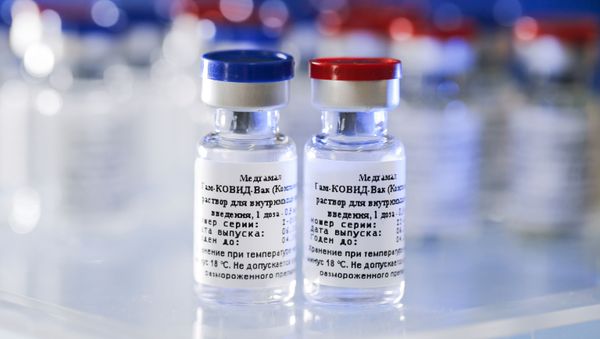 In this handout photo released by Russian Direct Investment Fund and the Gamaleya Scientific Research Institute of Epidemiology and Microbiology, phials of the world's first coronavirus vaccine registered in Russia are pictured, in Moscow, Russia. - Sputnik International