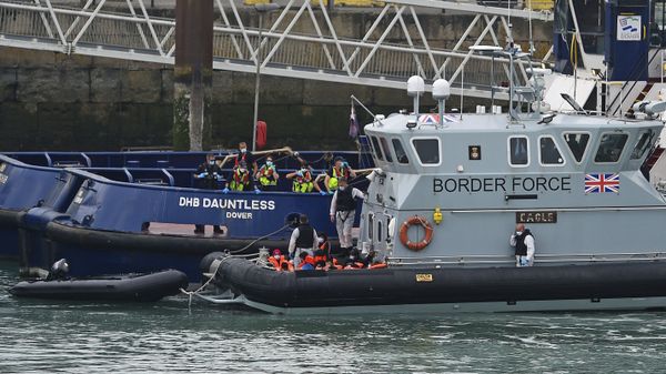 A group of people thought to be migrants are brought into Dover, England, Wednesday Aug. 12, 2020, by Border Force officers. (Kirsty O'Connor/PA via AP) - Sputnik International