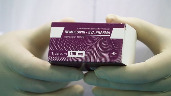 FILE PHOTO: A lab technicians holds the coronavirus disease (COVID-19) treatment drug Remdesivir at Eva Pharma Facility in Cairo, Egypt June 25, 2020.  - Sputnik International