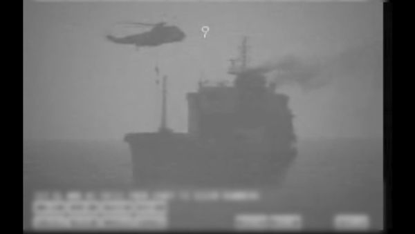 In this image made from video released by the U.S. military's Central Command, Iranian commandos fast-rope down from a helicopter onto the MV Wila oil tanker in the Gulf of Oman off the coast of the United Arab Emirates on Wednesday, Aug. 12, 2020 - Sputnik International