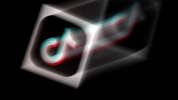 In this photo illustration, the social media application logo, TikTok is displayed on the screen of an iPhone on August 3, 2020 in Arlington, Virginia - Sputnik International