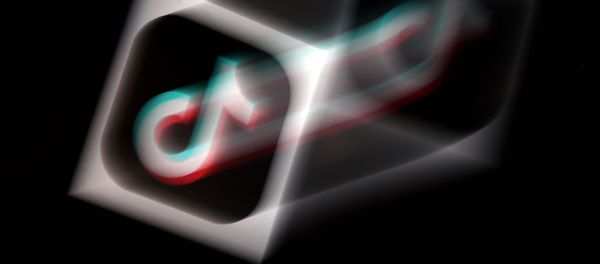 In this photo illustration, the social media application logo, TikTok is displayed on the screen of an iPhone on August 3, 2020 in Arlington, Virginia - Sputnik International