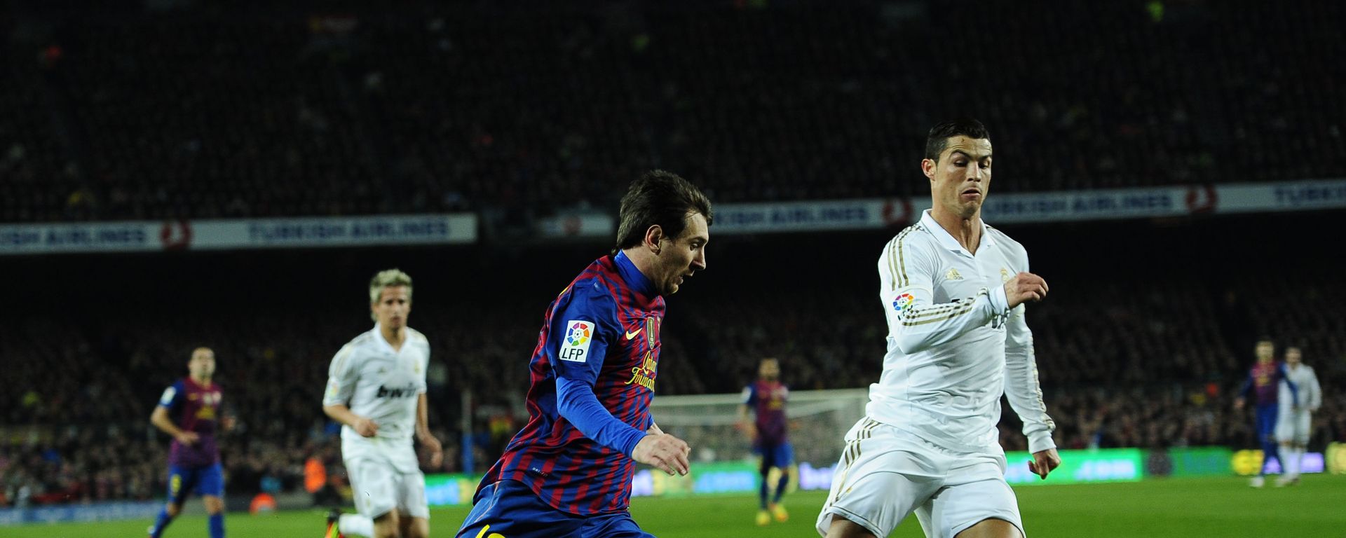 FC Barcelona's Lionel Messi, from Argentina, left, duels for the ball against Real Madrid's Cristiano Ronaldo, from Portugal, during their quarterfinal, second leg, Copa del Rey soccer match at the Camp Nou stadium, in Barcelona, Spain, Wednesday, Jan. 25, 2012 FC Barcelona's Lionel Messi, from Argentina, left, duels for the ball against Real Madrid's Cristiano Ronaldo, from Portugal, during their quarterfinal, second leg, Copa del Rey soccer match at the Camp Nou stadium, in Barcelona, Spain, Wednesday, Jan. 25, 2012 - Sputnik International, 1920, 01.01.2021