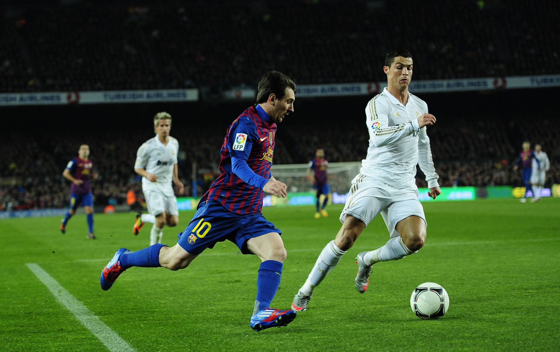 FC Barcelona's Lionel Messi, from Argentina, left, duels for the ball against Real Madrid's Cristiano Ronaldo, from Portugal, during their quarterfinal, second leg, Copa del Rey soccer match at the Camp Nou stadium, in Barcelona, Spain, Wednesday, Jan. 25, 2012 FC Barcelona's Lionel Messi, from Argentina, left, duels for the ball against Real Madrid's Cristiano Ronaldo, from Portugal, during their quarterfinal, second leg, Copa del Rey soccer match at the Camp Nou stadium, in Barcelona, Spain, Wednesday, Jan. 25, 2012 - Sputnik International, 1920, 07.09.2021