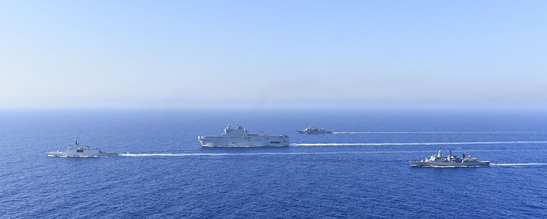 In this photo provided by the Greek National Defence, a French Tonnerre helicopter carrier, center, and French Lafayette frigate, left, are escorted by Greek and French military vessels during a maritime exercise in the Eastern Mediterranean, Thursday, Aug. 13, 2020 In this photo provided by the Greek National Defence, a French Tonnerre helicopter carrier, center, and French Lafayette frigate, left, are escorted by Greek and French military vessels during a maritime exercise in the Eastern Mediterranean, Thursday, Aug. 13, 2020 - Sputnik International, 1920, 11.09.2020