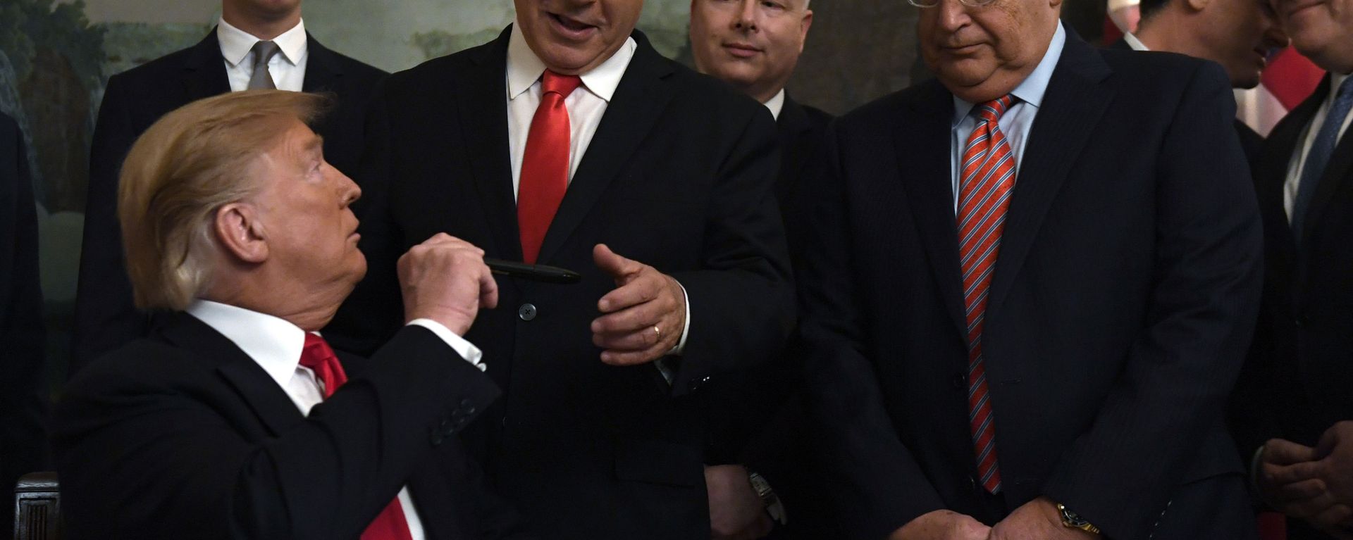 President Donald Trump, left, turns to give a pen to Israeli Prime Minister Benjamin Netanyahu, center, after signing a proclamation in the Diplomatic Reception Room at the White House in Washington, Monday, March 25, 2019. Trump signed an official proclamation formally recognizing Israel's sovereignty over the Golan Heights. Other attending are, from left, White House adviser Jared Kushner, U.S. special envoy Jason Greenblatt, U.S. Ambassador to Israel David Friedman, Israeli Ambassador to the U. S. Ron Dermer, and Secretary of State Mike Pompeo. President Donald Trump, left, turns to give a pen to Israeli Prime Minister Benjamin Netanyahu, center, after signing a proclamation in the Diplomatic Reception Room at the White House in Washington, Monday, March 25, 2019. Trump signed an official proclamation formally recognizing Israel's sovereignty over the Golan Heights. Other attending are, from left, White House adviser Jared Kushner, U.S. special envoy Jason Greenblatt, U.S. Ambassador to Israel David Friedman, Israeli Ambassador to the U. S. Ron Dermer, and Secretary of State Mike Pompeo. - Sputnik International, 1920, 03.02.2022