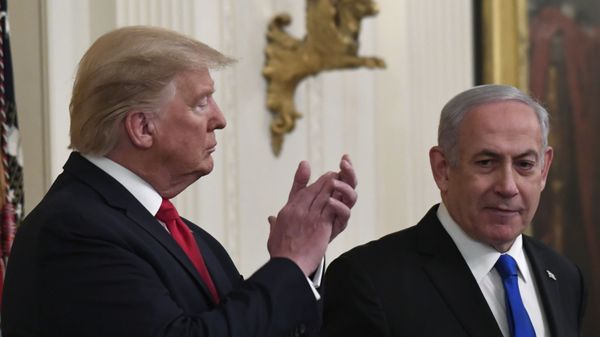 President Donald Trump, left, listens as Israeli Prime Minister Benjamin Netanyahu, right, speaks during an event in the East Room of the White House in Washington, Tuesday, Jan. 28, 2020, to announce the Trump administration's much-anticipated plan to resolve the Israeli-Palestinian conflict. President Donald Trump, left, listens as Israeli Prime Minister Benjamin Netanyahu, right, speaks during an event in the East Room of the White House in Washington, Tuesday, Jan. 28, 2020, to announce the Trump administration's much-anticipated plan to resolve the Israeli-Palestinian conflict. - Sputnik International