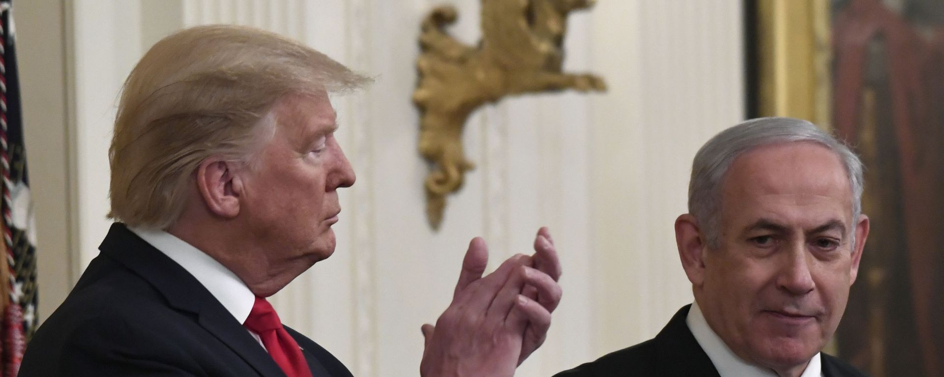 President Donald Trump, left, listens as Israeli Prime Minister Benjamin Netanyahu, right, speaks during an event in the East Room of the White House in Washington, Tuesday, Jan. 28, 2020, to announce the Trump administration's much-anticipated plan to resolve the Israeli-Palestinian conflict.  - Sputnik International, 1920, 13.08.2020