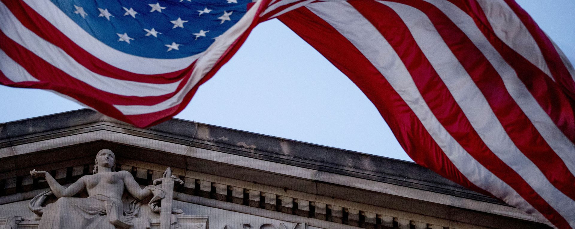 In this March 22, 2019 file photo, an American flag flies outside the Department of Justice in Washington In this March 22, 2019 file photo, an American flag flies outside the Department of Justice in Washington - Sputnik International, 1920, 23.08.2023