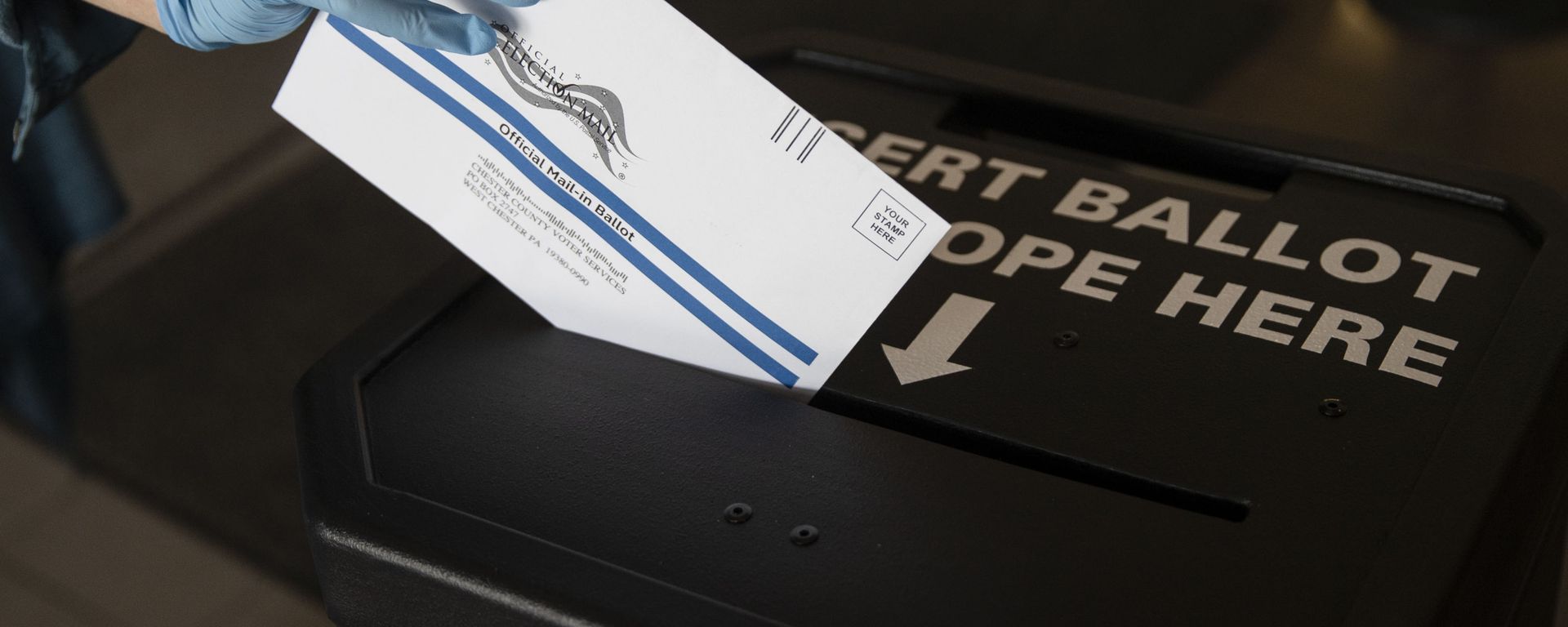 In this May 28, 2020, file photo a voter casts her mail-in ballot at in a drop box in West Chester, Pa., prior to the primary election. Just over four months before Election Day, President Donald Trump is escalating his efforts to delegitimize the upcoming presidential election - Sputnik International, 1920, 05.09.2023