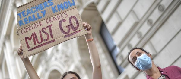 People take part in a protest in Westminster in London over the government's handling of A-level results, Friday, Aug. 14, 2020. Thousands of school-leaving children in Britain have been left distraught after finding out that they were handed lower-than-expected grades. The government is under growing pressure to address the question of how to fairly award students grades in the absence of actual exams. - Sputnik International