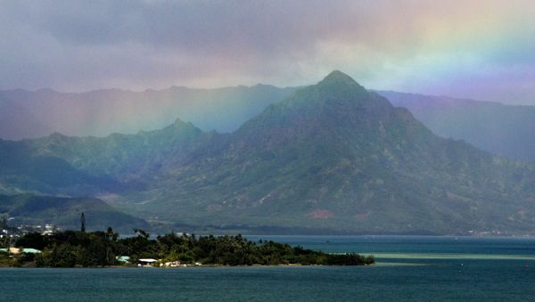 President Barack Obama's motorcade passes Kaneohe Bay as heads for the beach at Bellows Air Force Station, Saturday, Jan. 3, 2015, on the island of Oahu in Hawaii, on the final day of the Obama family vacation.  - Sputnik International