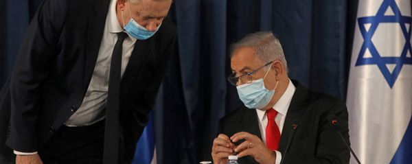 FILE PHOTO: Israeli Prime Minister Benjamin Netanyahu speaks with Alternate Prime Minister and Defence Minister Benny Gantz, as they both wear a protective mask due to the ongoing coronavirus disease (COVID-19) pandemic, during the weekly cabinet meeting in Jerusalem June 7, 2020 FILE PHOTO: Israeli Prime Minister Benjamin Netanyahu speaks with Alternate Prime Minister and Defence Minister Benny Gantz, as they both wear a protective mask due to the ongoing coronavirus disease (COVID-19) pandemic, during the weekly cabinet meeting in Jerusalem June 7, 2020 - Sputnik International