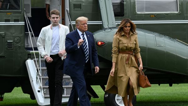 U.S. President Donald Trump, First Lady Melania Trump and their son Barron disembark from Marine One upon returning to the White in Washington, U.S. August 16, 2020. - Sputnik International