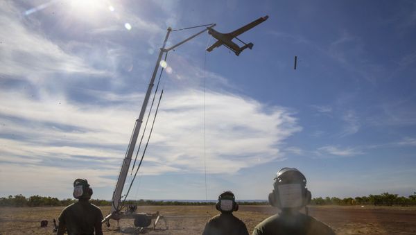 U.S. Marines with Air Combat Element, Marine Rotational Force – Darwin recover the RQ-21A Blackjack following spoke operations in Bradshaw Field Training Area, Northern Territory, Australia, Aug. 9, 2020 - Sputnik International