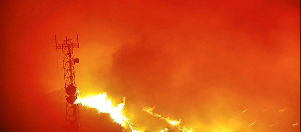 Flames from the Hennessey Fire rage in the last image from a tower-mounted camera before it and another went offline, after they melted in the heat according to AlertWildfire, on Atlas Peak northwest of Vacaville, California, U.S. August 18, 2020. Picture taken August 18, 2020.   www.alertwildfire.org/Handout via REUTERS.  NO RESALES. NO ARCHIVES. THIS IMAGE HAS BEEN SUPPLIED BY A THIRD PARTY. - Sputnik International