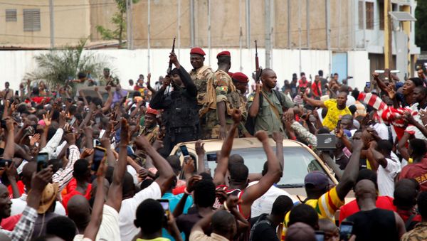 A crowd of people cheer Malian army soldiers at the Independence Square in Bamako A crowd of people cheer Malian army soldiers at the Independence Square in Bamako - Sputnik International