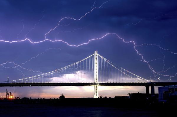 Lightning bolts over the San Francisco-Oakland Bay Bridge as a storm passes over Oakland, California, Sunday, 16 August 2020. - Sputnik International